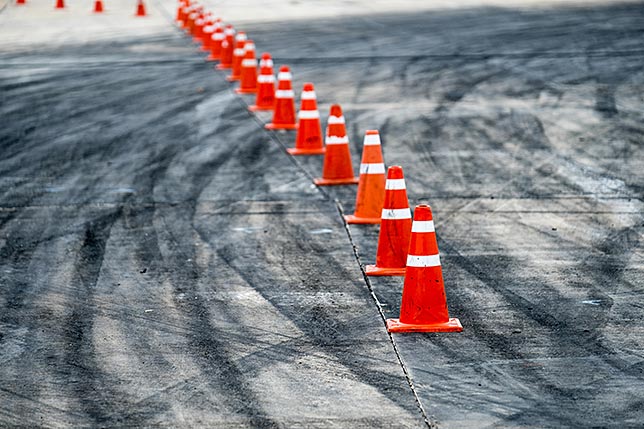 A row of construction cones acting as obstacles on safety course