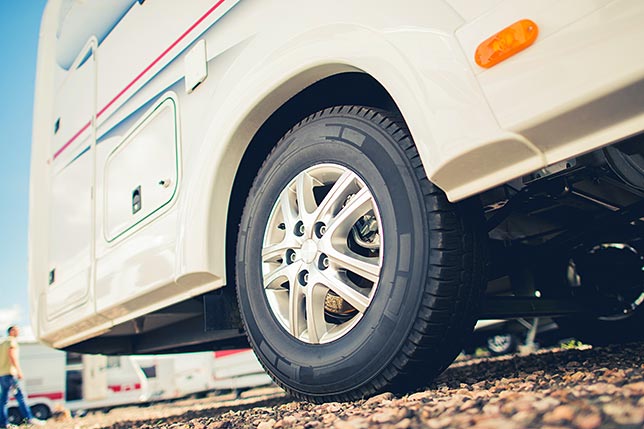 A close-up of a parked RV tire